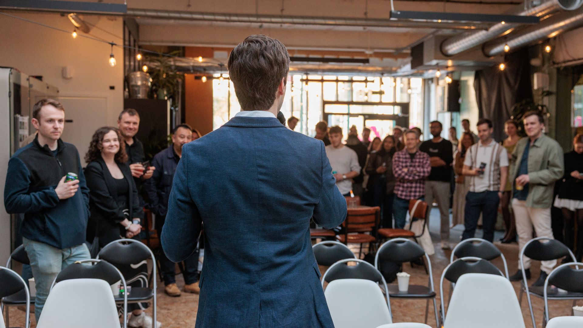 Sindre speaking to audience